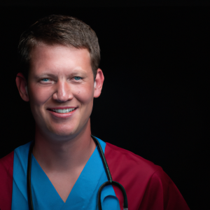 a professional and visually appealing image of a young happy smiling caucasian doctor with white teeth