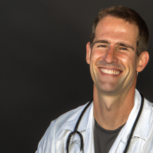 a professional and visually appealing image of a young happy smiling caucasian doctor with white teeth