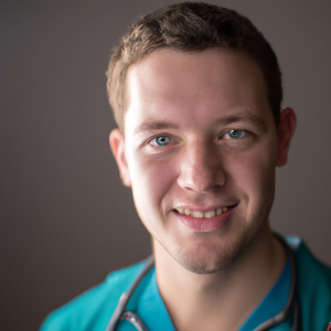 a professional and visually appealing image of a young happy smiling caucasian doctor with white teeth