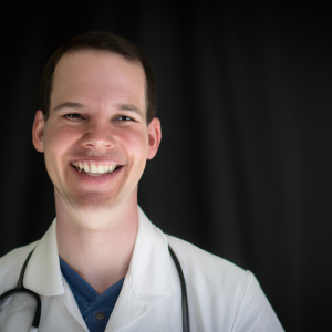 a professional and visually appealing image of a young happy smiling caucasian doctor with white teeth