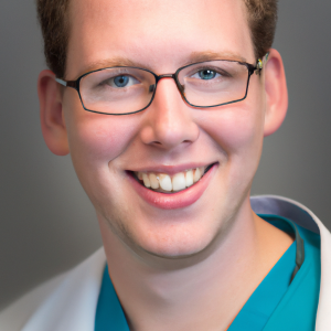 a professional and visually appealing image of a young happy smiling caucasian doctor with white teeth