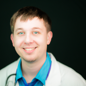 a professional and visually appealing image of a young happy smiling caucasian doctor with white teeth