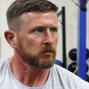 a professional appealing good looking and atheletic image of a caucasian man exercising in a gym