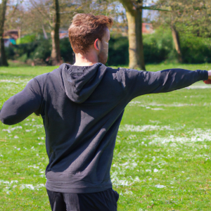 a professional appealing good looking and atheletic image of a caucasian man exercising or playing sports outside on a sunny day